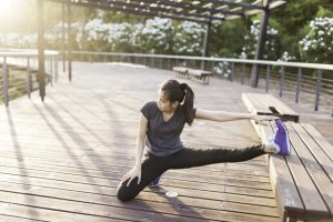 flexible-woman-stretching-with-leg-bench-1024×683