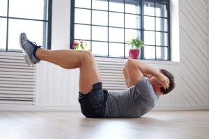athletic-middle-age-man-doing-stomach-workouts-home_613910-14272