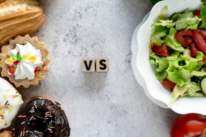 high-angle-view-healthy-vs-unhealthy-food-concrete-background_23-2148193147