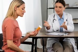 side-view-woman-holding-pills-container_23-2149485505